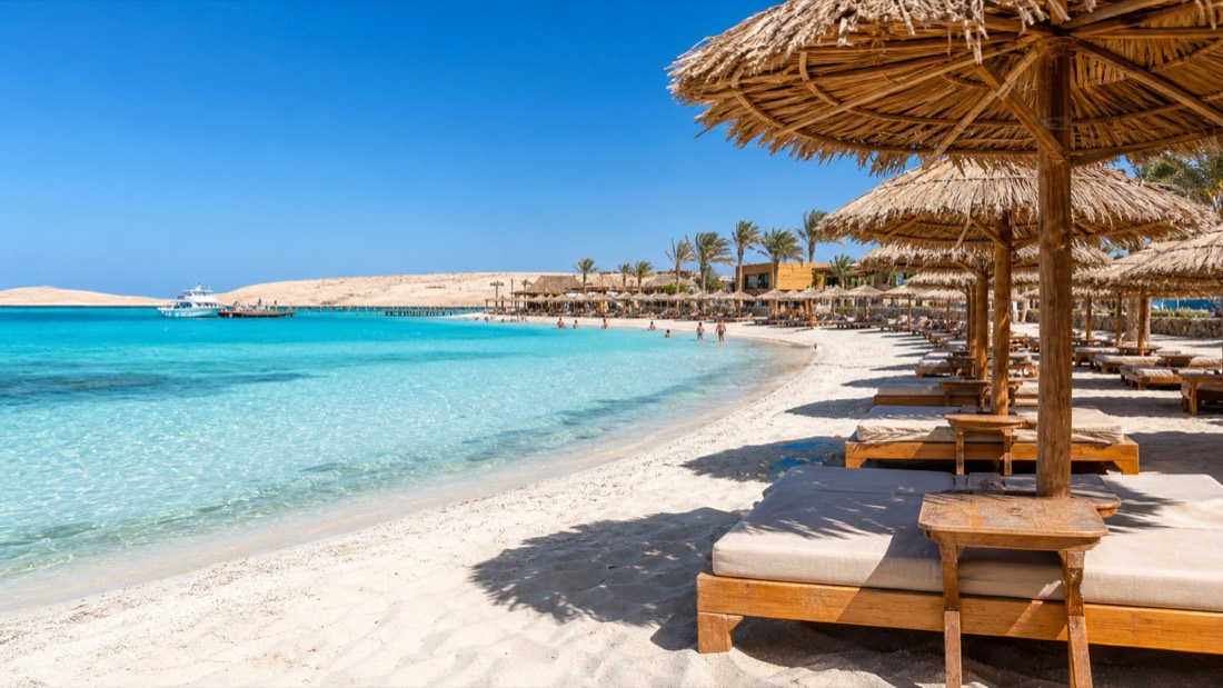 Orange Bay beach umbrellas and sunbeds